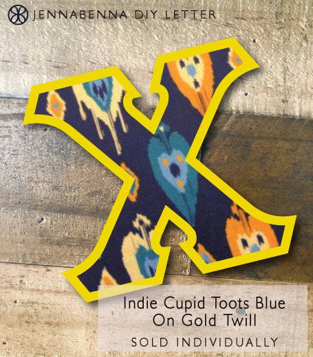 Indie Cupid Toots Blue on Gold Twill DIY Iron On Greek Letter - JennaBenna